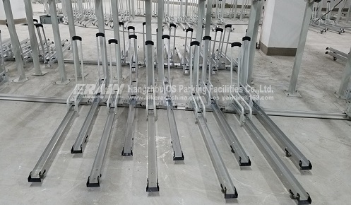 bottom racks of gas assisted two tier bicycle racks